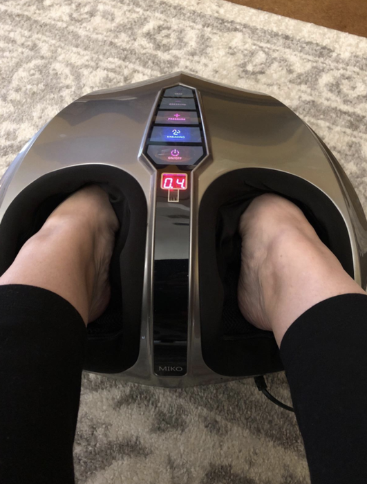 A close-up shot of the foot massager, highlighting how the feet fit in and the buttons on top for easy control.