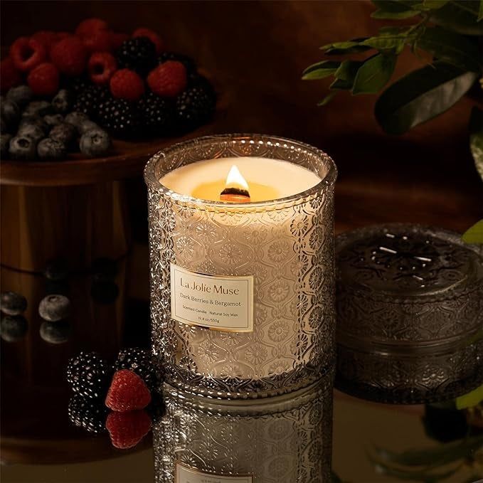 The berries-scented candle surrounded by fresh berries