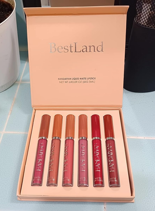 Six BestLand matte lipsticks in a box, showcasing a variety of shades, beautifully arranged on a counter.