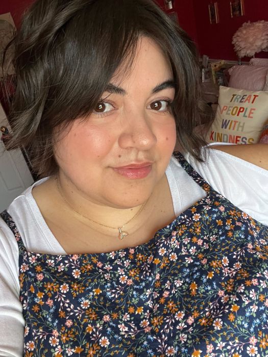 Bianca taking a selfie while wearing the black honey lipstick, looking effortlessly chic.