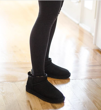 Reviewer rocking black soft ankle booties