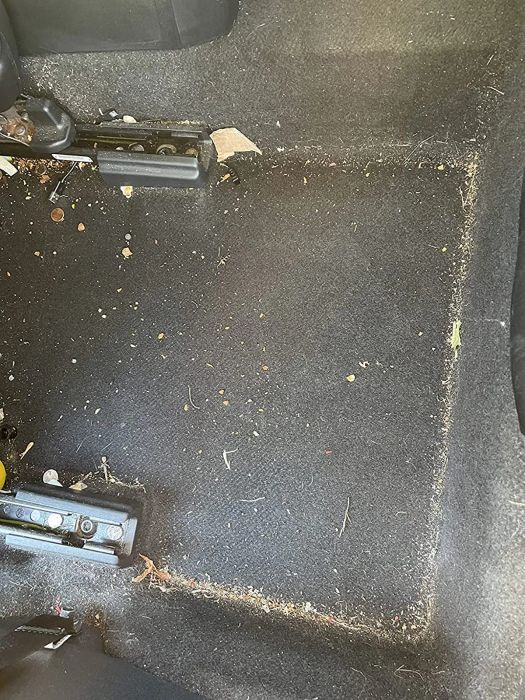 An image showing crumbs and debris scattered inside a car