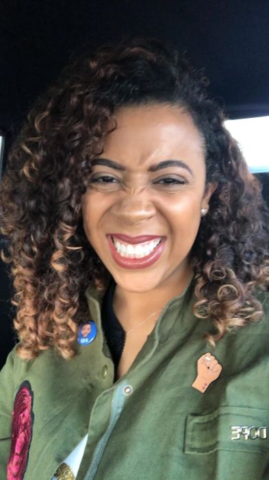 The same reviewer with a more defined curl pattern and less frizz.