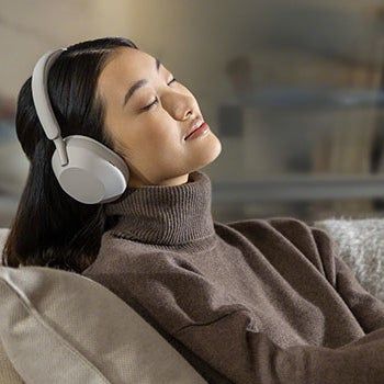 model sporting the headphones in white