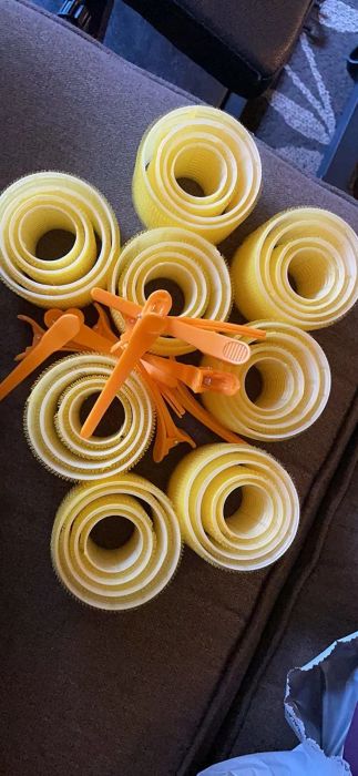 A photo of the yellow velcro rollers and clips from a reviewer.
