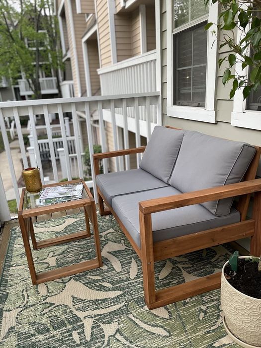 A side view of the loveseat on another reviewer's balcony