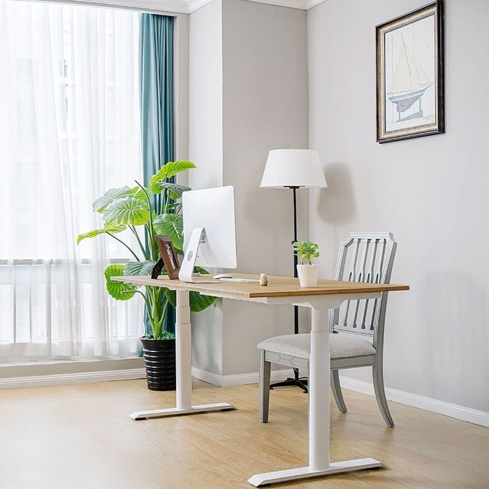 The bamboo desk surface with sleek white legs.