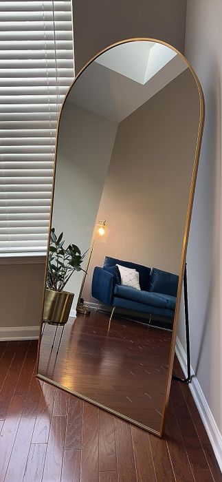 reviewer's full-length mirror featuring a gold frame