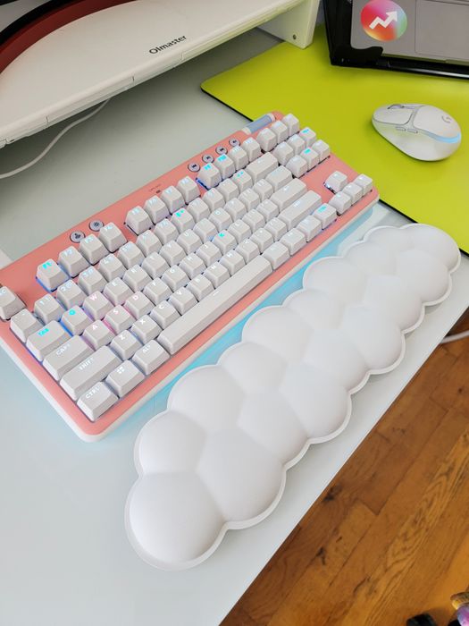 Mytour editor's Logitech keyboard featuring a pink faceplate along with the cloud wrist rest.