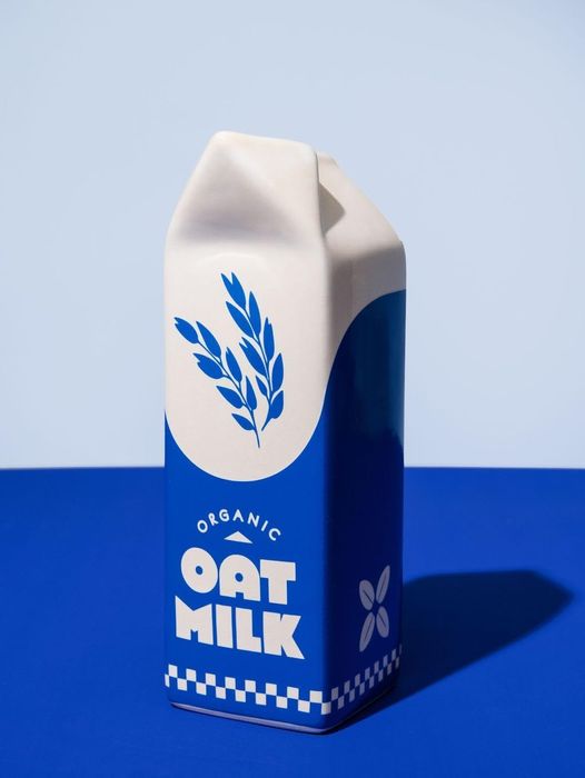 An oat milk carton vase.
