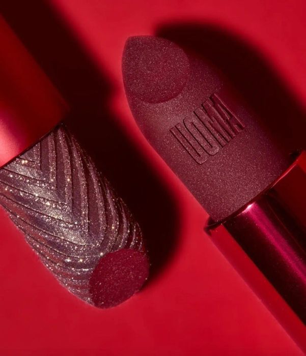 Two red lipstick tubes on display
