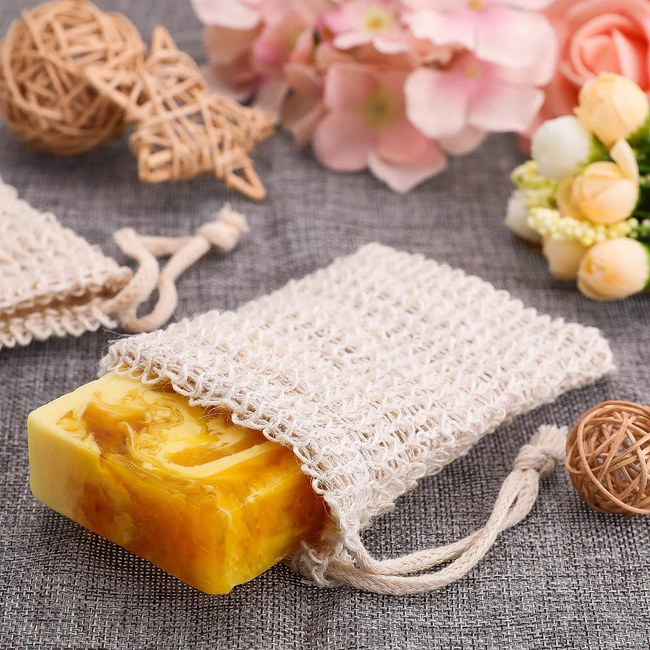 A bar of soap tucked inside a cream-colored, textured pouch with tie closures at the top.