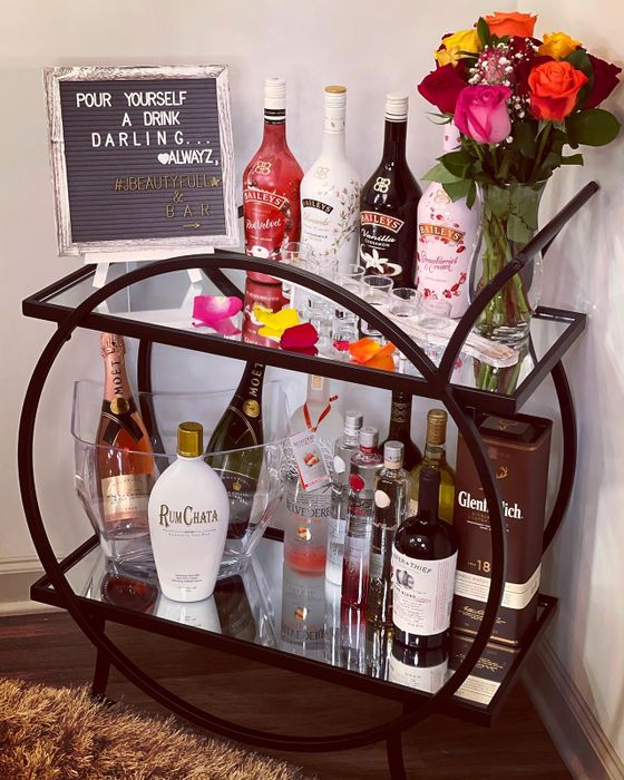 reviewer's styled bar cart with a sleek black frame