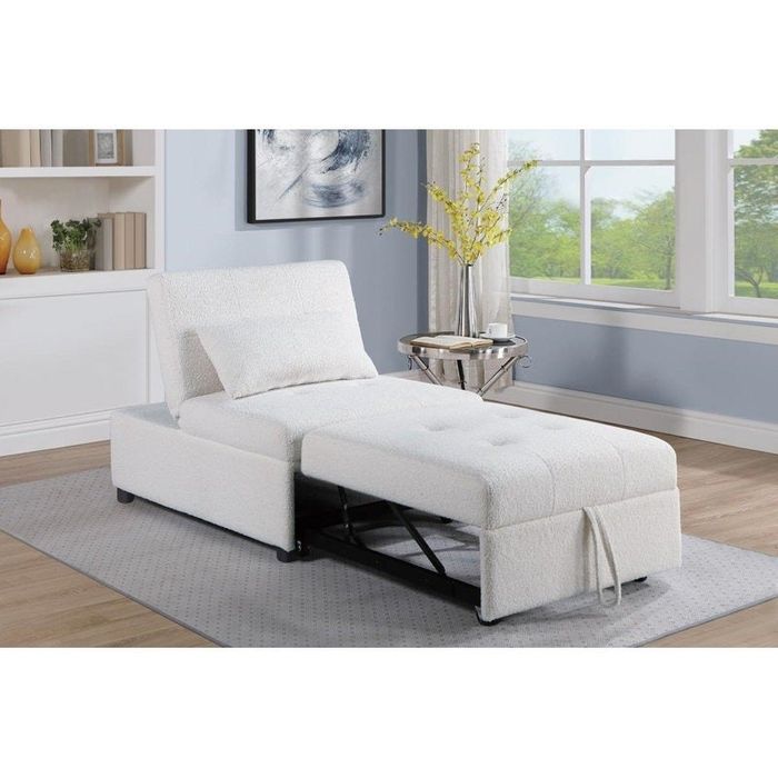 A sleek, adjustable white chaise lounge positioned in a modern living room, featuring large windows and decorative shelves that enhance the atmosphere.