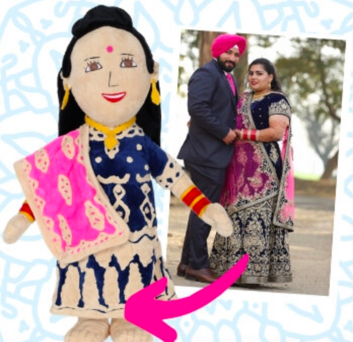 A doll dressed in traditional clothing that matches the photo