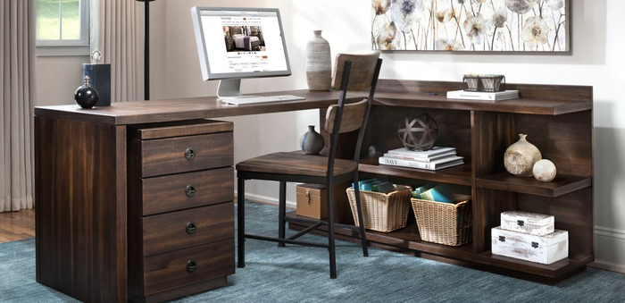 dark brown wooden L-shaped desk with a three-shelf unit attached in an office setting