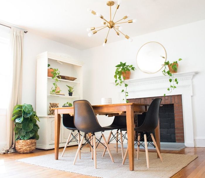 A set of four black chairs surrounding a reviewer's dining table.