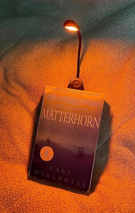 A book light clipped onto a book