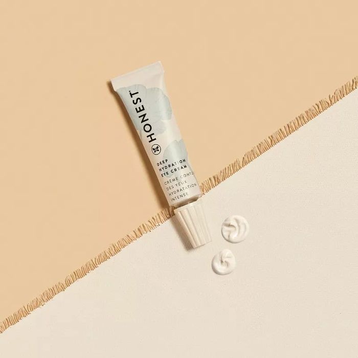 A tube of eye cream with a swatch to show its creamy texture