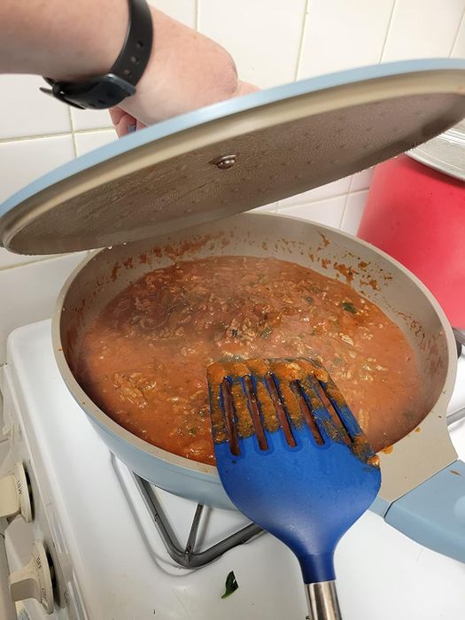 A reviewer cooking in a light blue Goodful pan