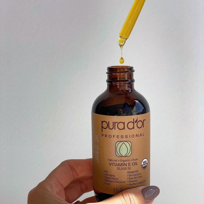 A bottle of the oil, showcasing its dropper applicator
