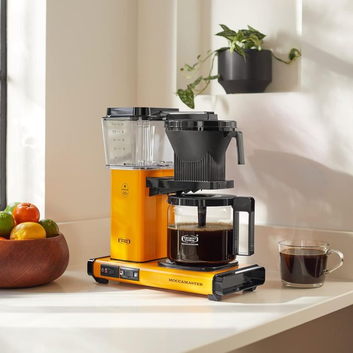 A yellow Moccamaster coffee machine.