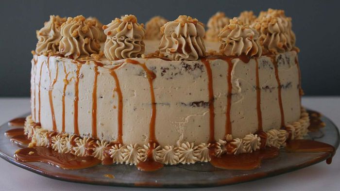 Applying frosting to a warm cake