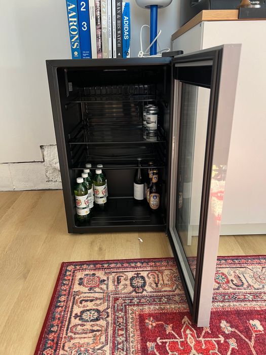 The interior of the beverage fridge, where all your drinks are neatly stored and within easy reach.