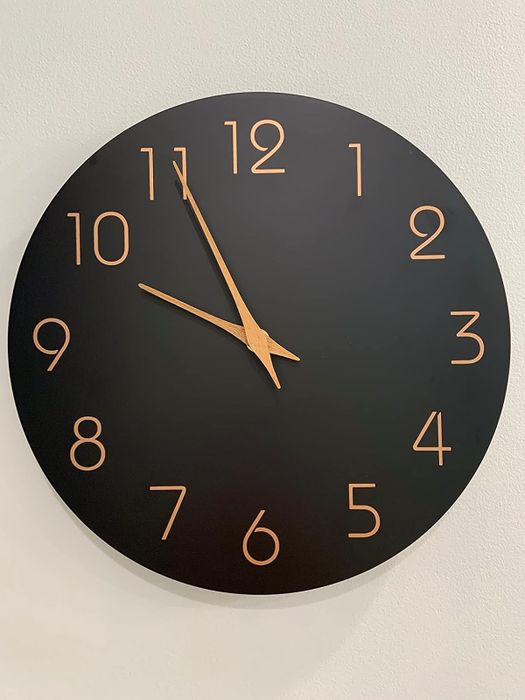 reviewer's black clock with golden numerals