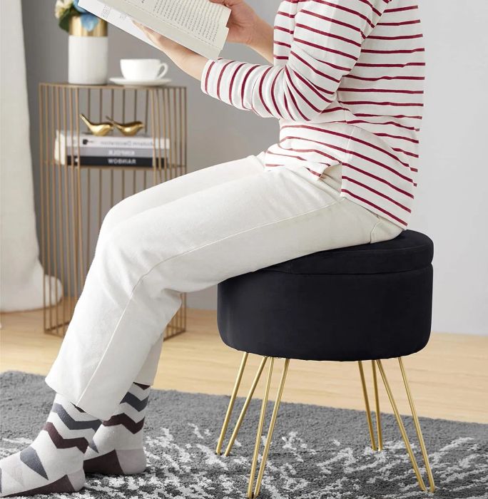 A model sitting on the stool.