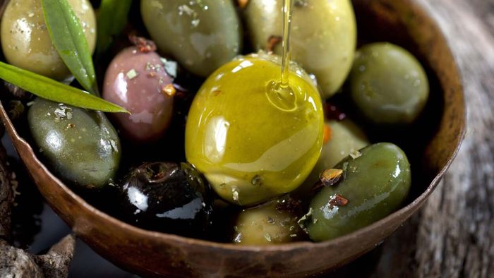 Heat olives in a fragrant oil for a luxurious snack