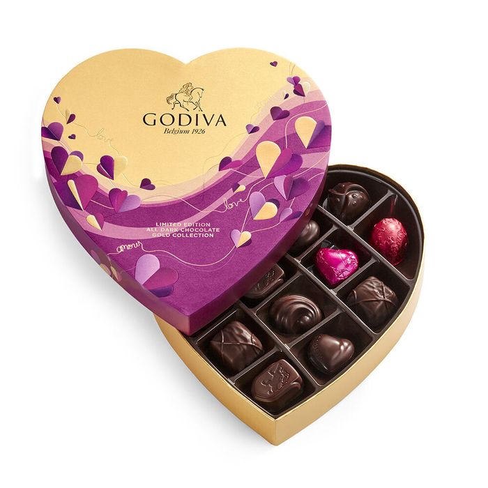 a heart-shaped box filled with chocolates