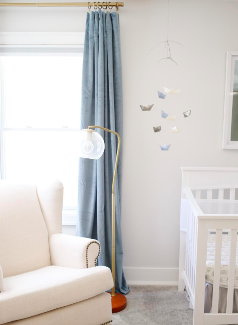 A customer's photo of the velvet curtains in a deep slate color.