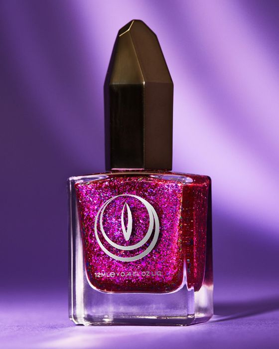 Vibrant purple and pink glitter nail polish.