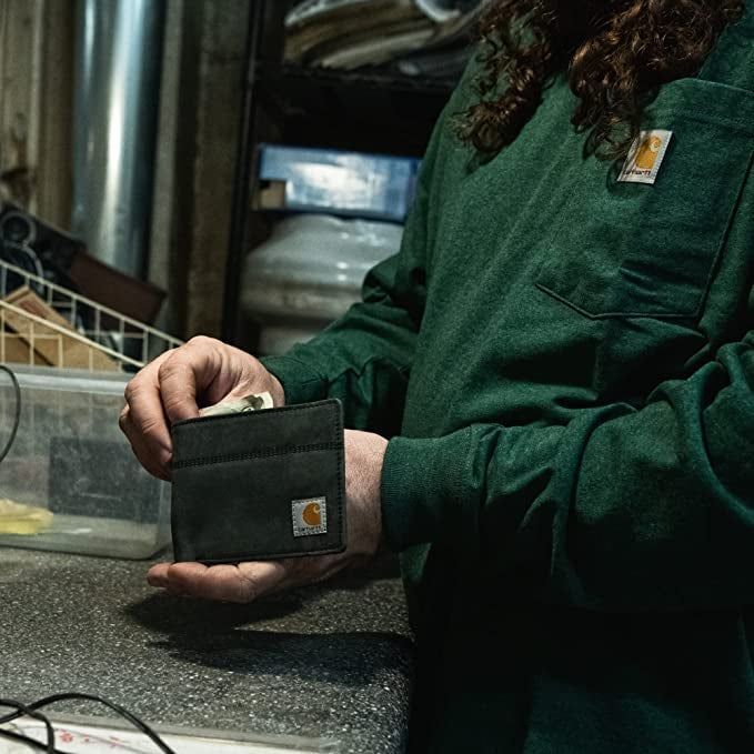 a model showcasing their leather wallet