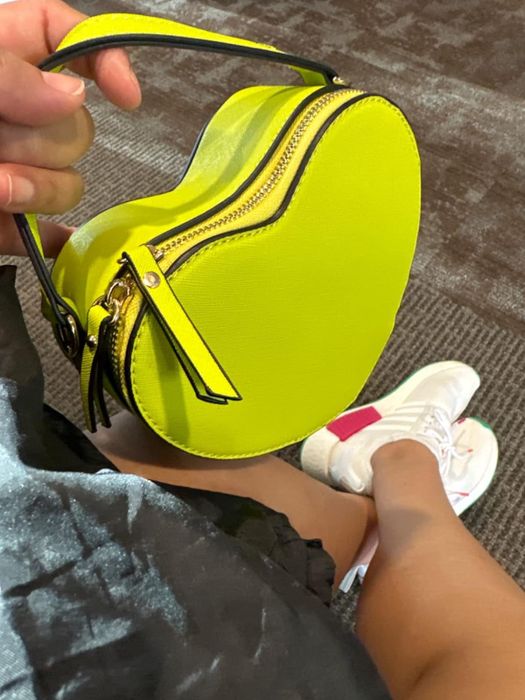 A bright yellow heart-shaped bag.