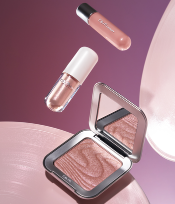 The Yours Truly R.e.m. beauty set featuring a liquid lip gloss, highlighter, and liquid eyeshadow.