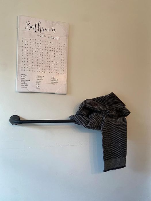 bathroom-themed word search on reviewer's wall, framed for decor