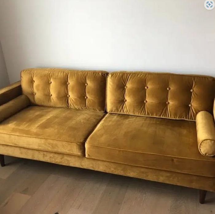 velvet mustard yellow sofa with armrests