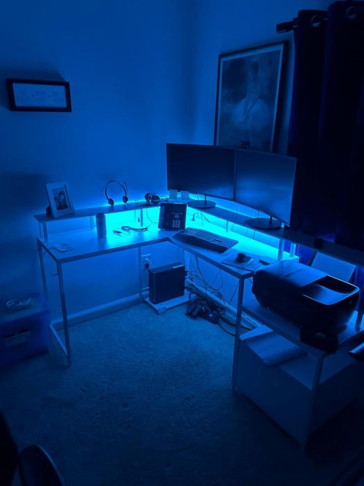 a reviewer's desk glowing with blue LED lights