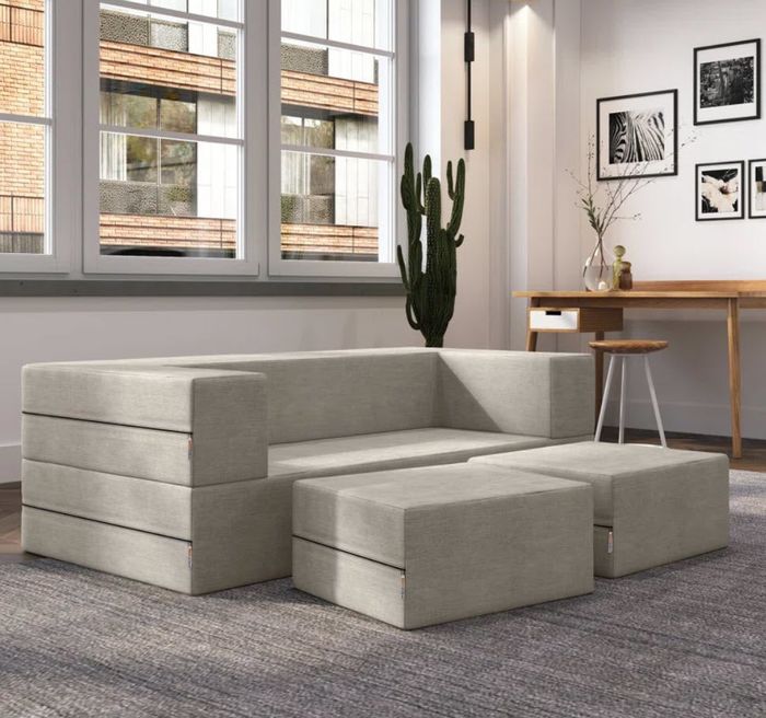 grey cubic couch featuring removable cushions for easy customization