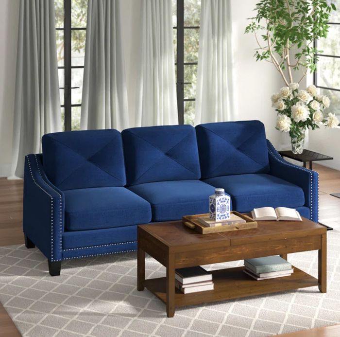 royal blue three-seat sofa with nailhead accents