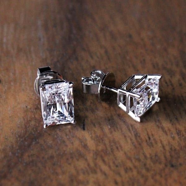 A pair of radiant cut diamond stud earrings.