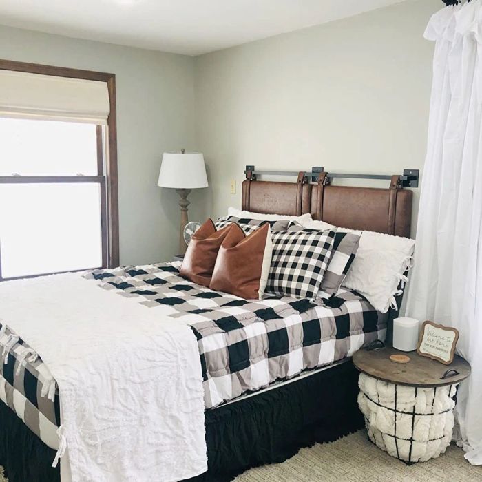 side view of a reviewer's brown headboard mounted on the wall