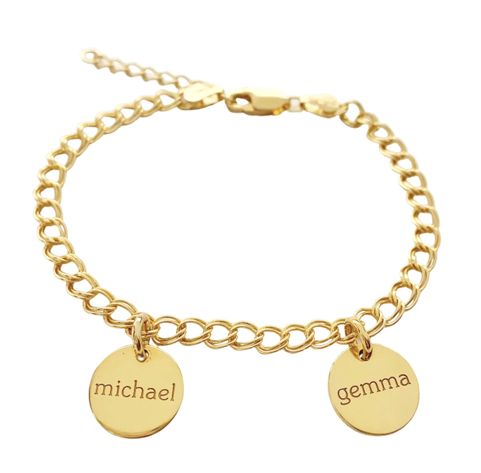 A gold bracelet adorned with two circular charms, each engraved with a name.
