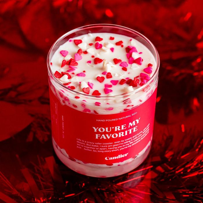A Valentine's Day candle topped with heart-shaped sprinkles
