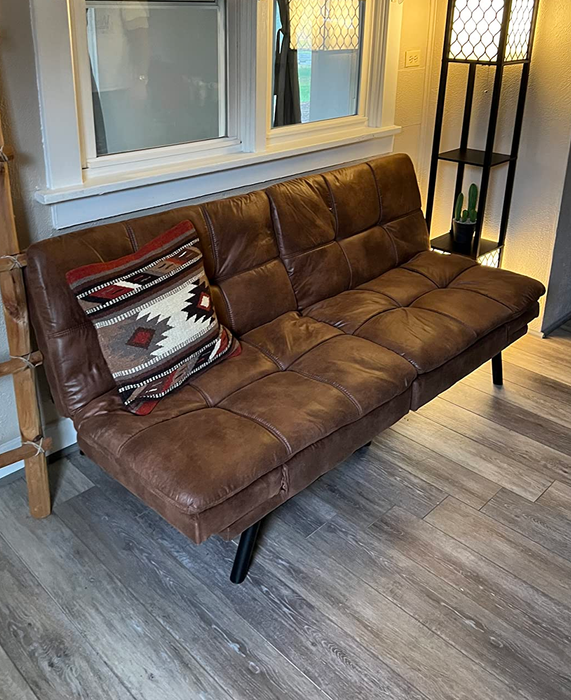 the reviewer's brown futon in the upright position