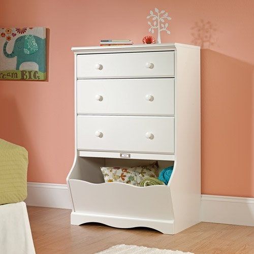 Three-drawer dresser with an open cubby, placed in a child's bedroom