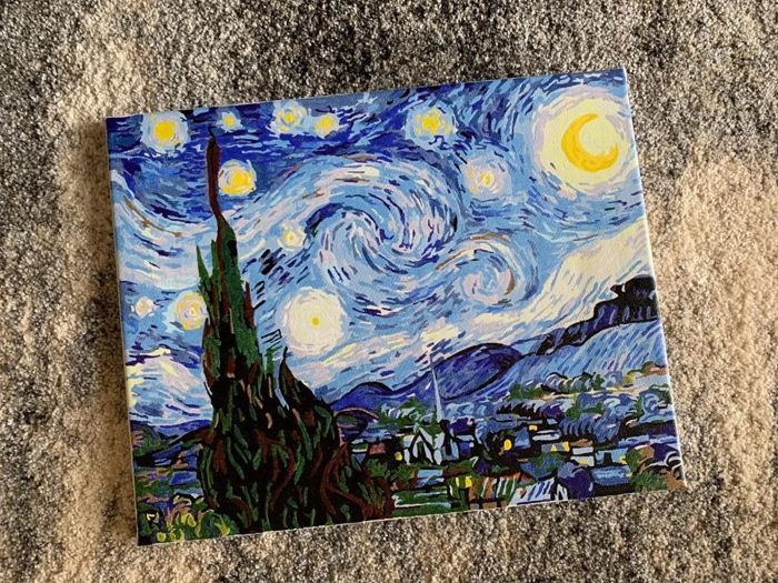 A finished paint-by-numbers canvas of Starry Night.