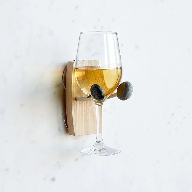 The holder displaying a glass of wine, resting comfortably in place.